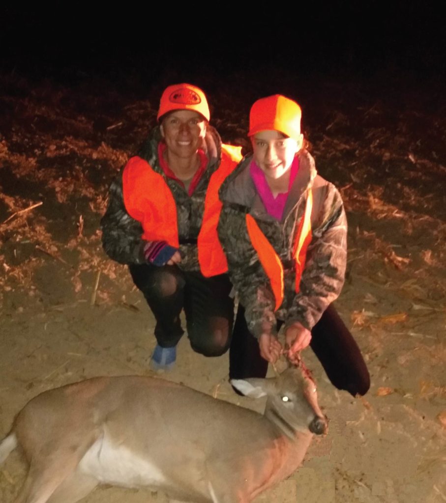 katie and emily locke with a deer they 